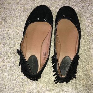 Black flats with fringe detail